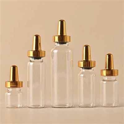 Flaconcino trasparente da 10 ml con tappo in alluminio con punta dorata